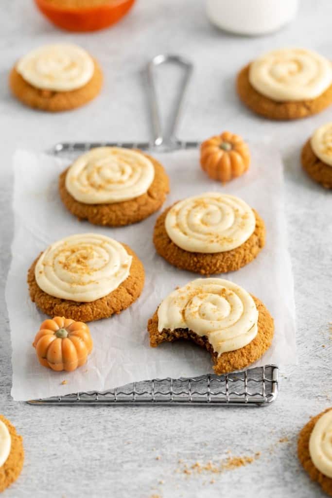 pumpkin cream cheese cookies with a bite out of them