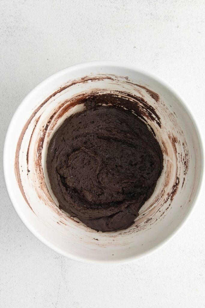 Chocolate blossoms dough in a mixing bowl.