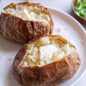 two potatoes on a white plate
