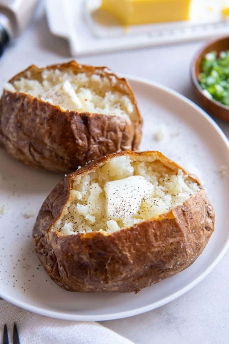 two potatoes on a white plate