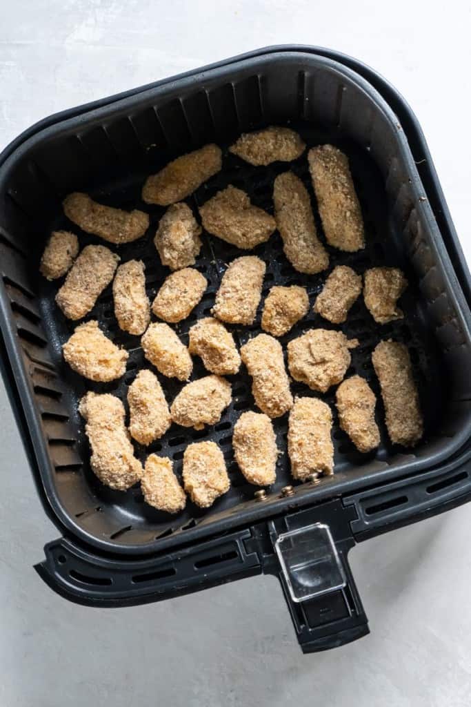 placing cheese curds in air fryer basket