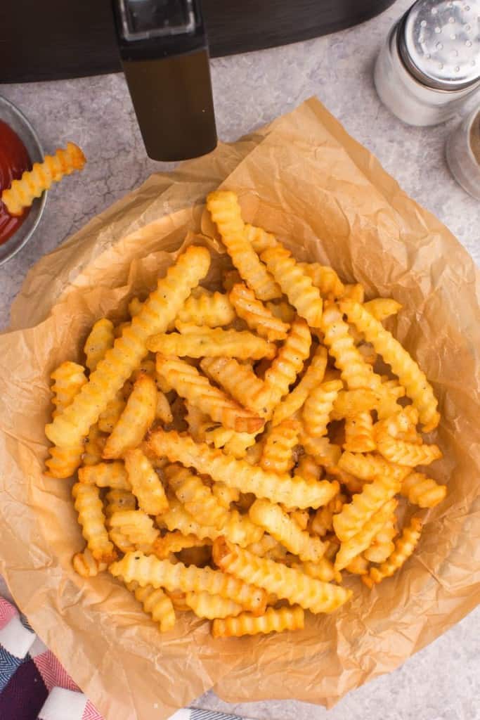 basket of air fryer crinkle cut french fries