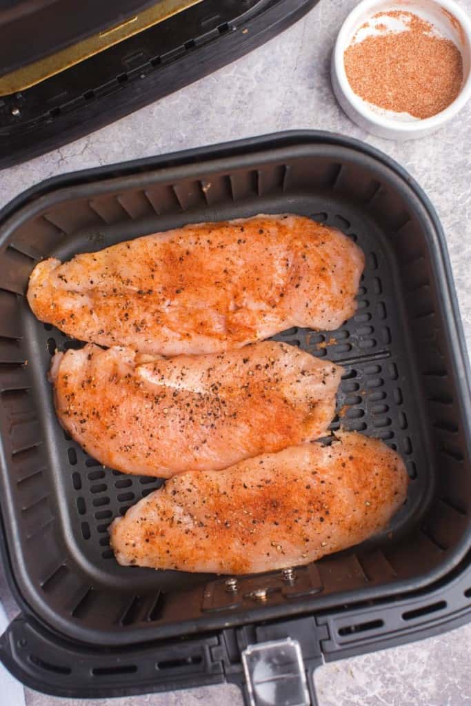 raw chicken in air fryer basket