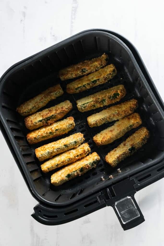air fryer basket with zucchini fries