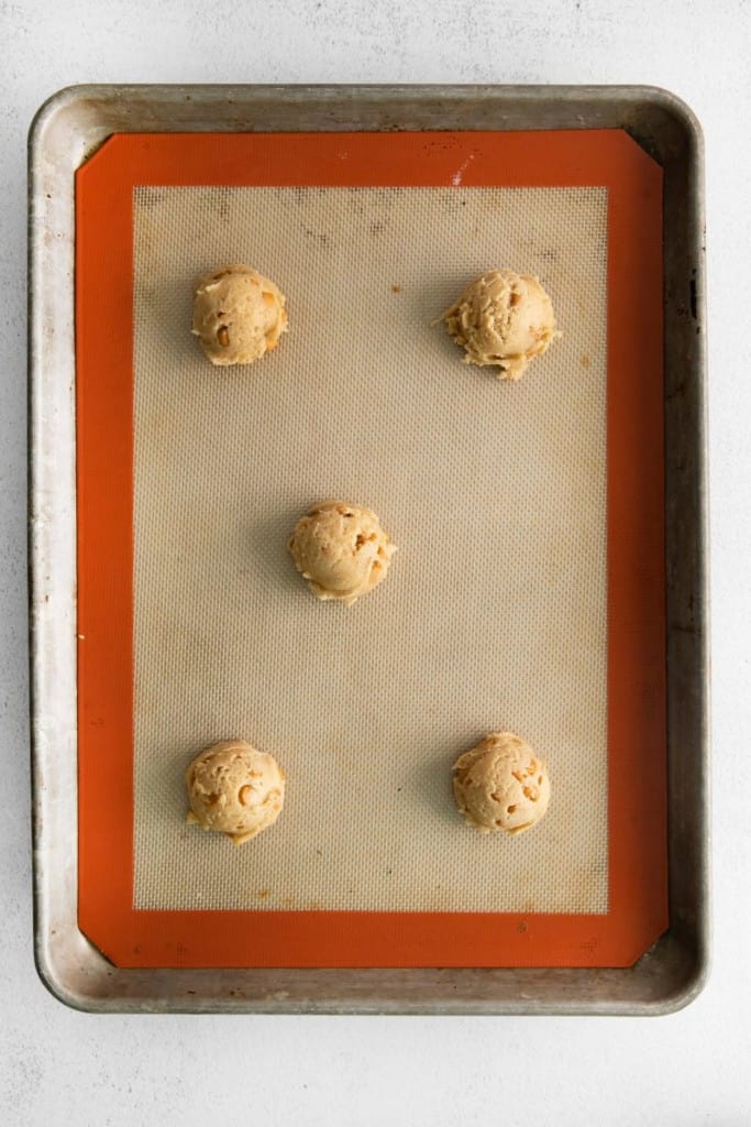 balls of cookie dough on baking sheet