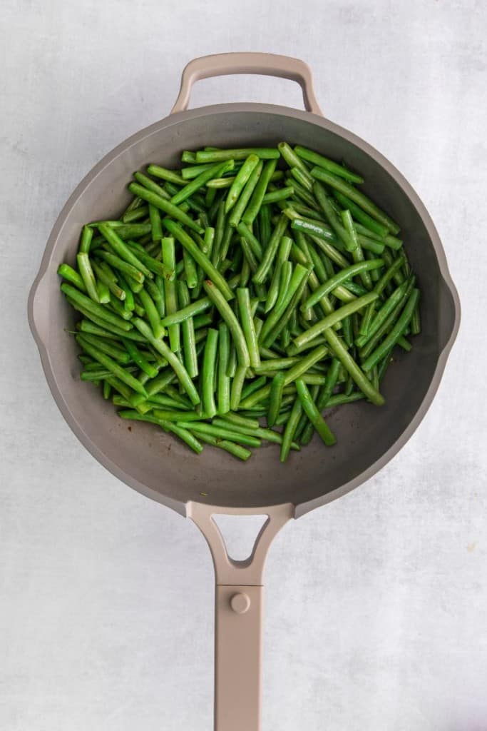 fresh green beans in a skillet.