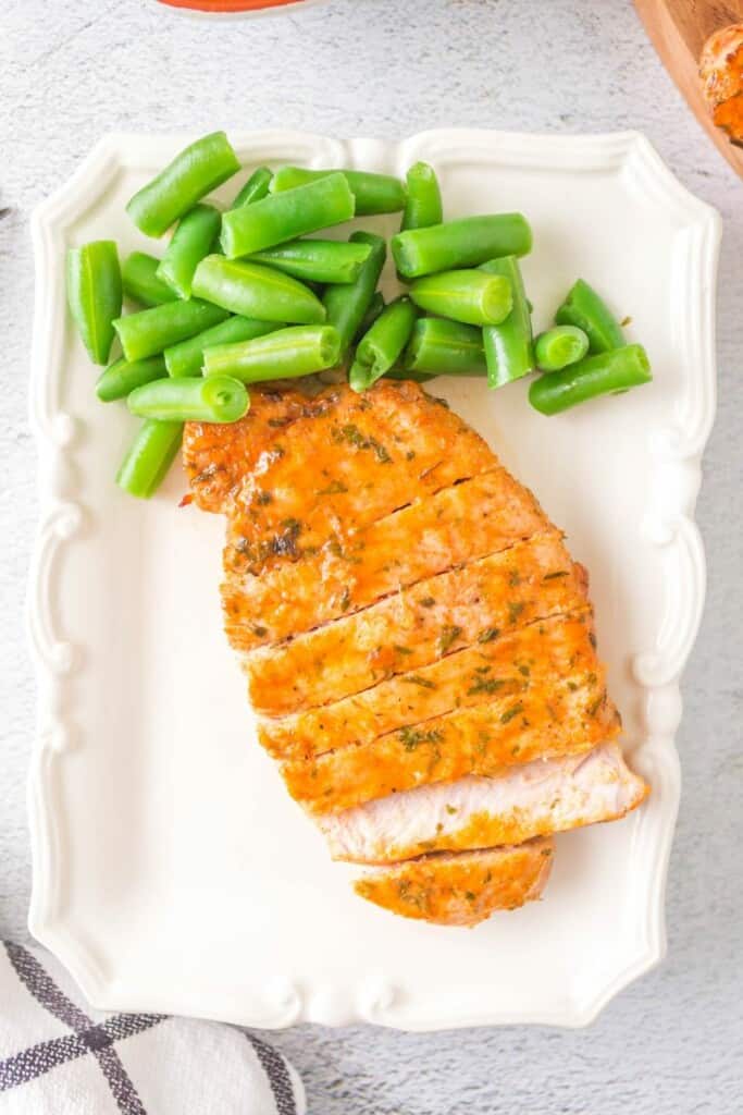 plate with pork chops and green beans