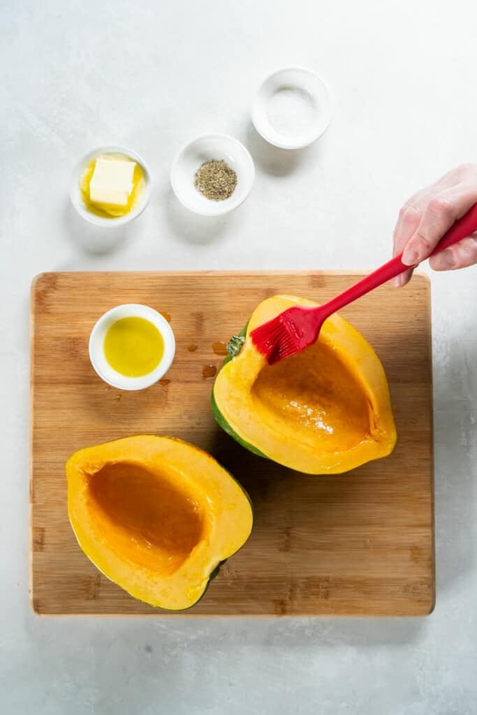 brushing ingredients onto acorn squash