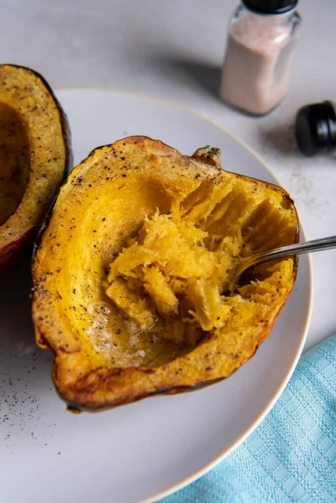 white plate with acorn squash