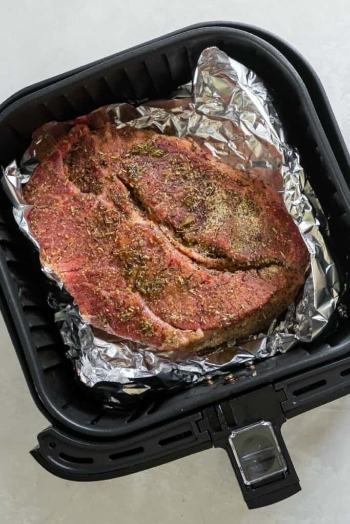 raw chuck roast in air fryer basket