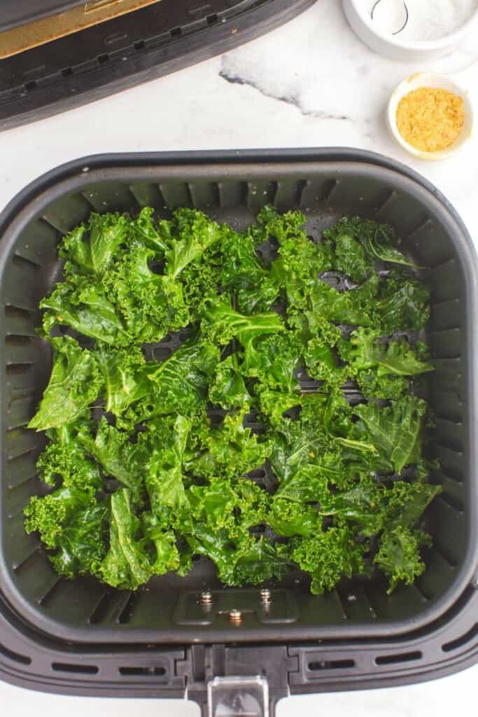 fresh kale in air fryer basket