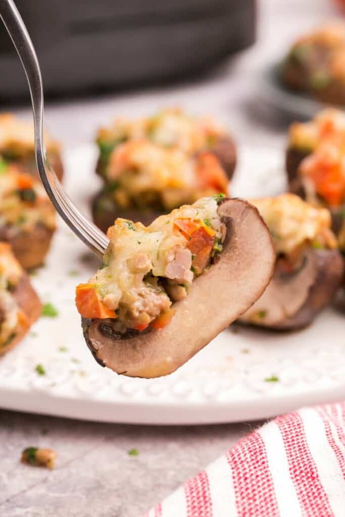 stuffed mushrooms on fork