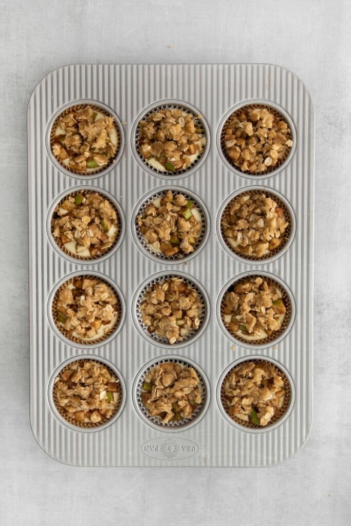 apple crisp mini cheesecakes in muffin tin
