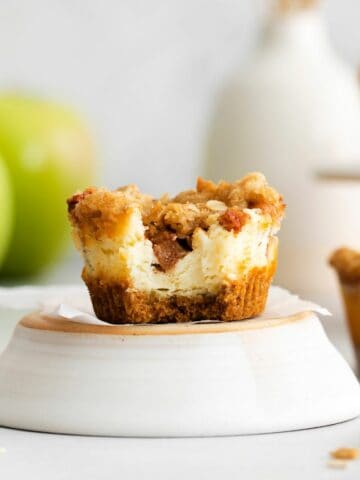 apple crisp cheesecake with bite out of it