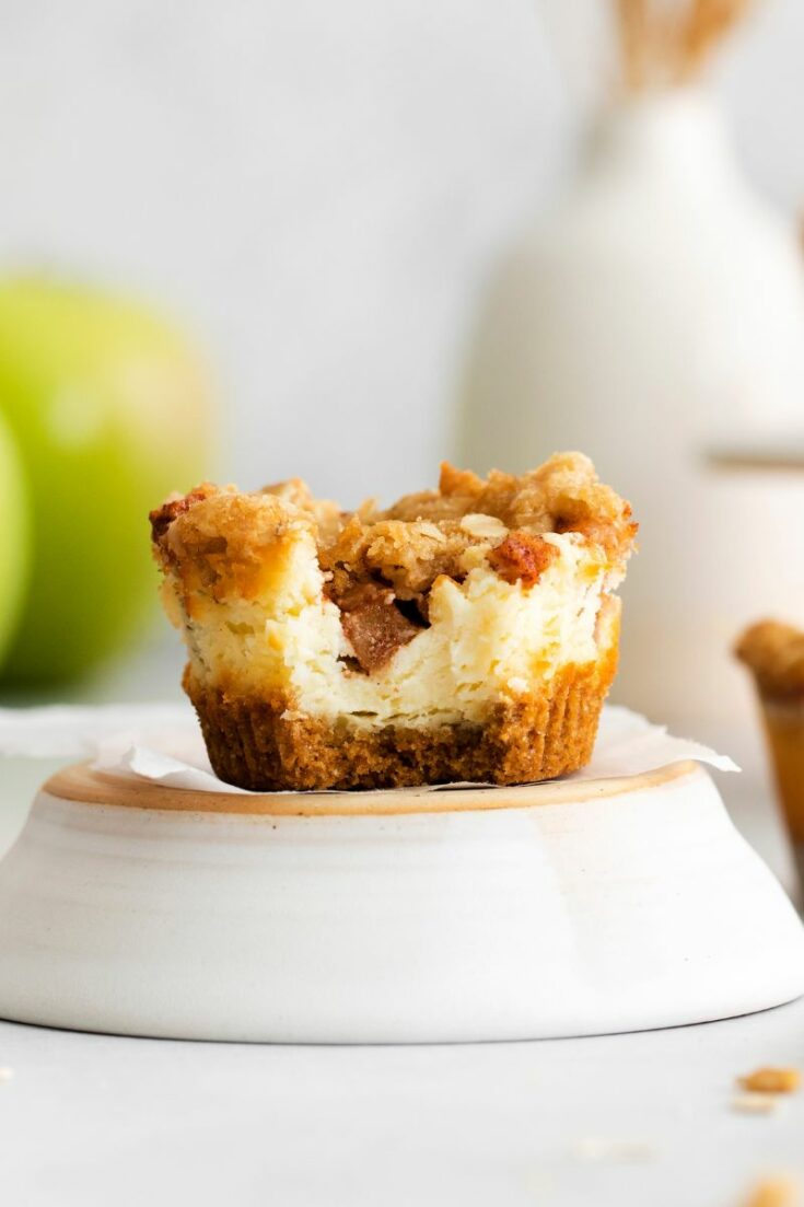 apple crisp cheesecake with bite out of it