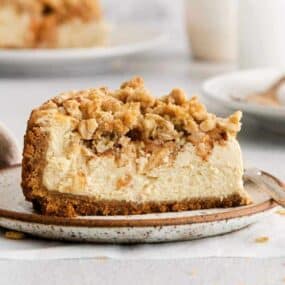 apple crumble cheesecake on a plate