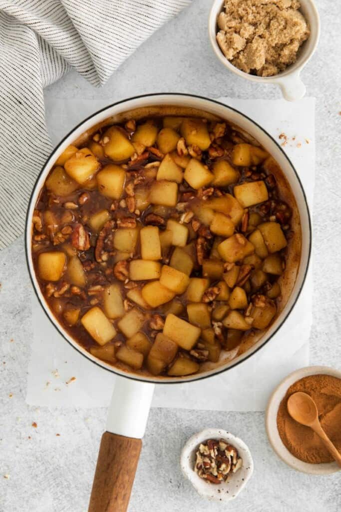 cinnamon roll apple pie filling in a saucepan