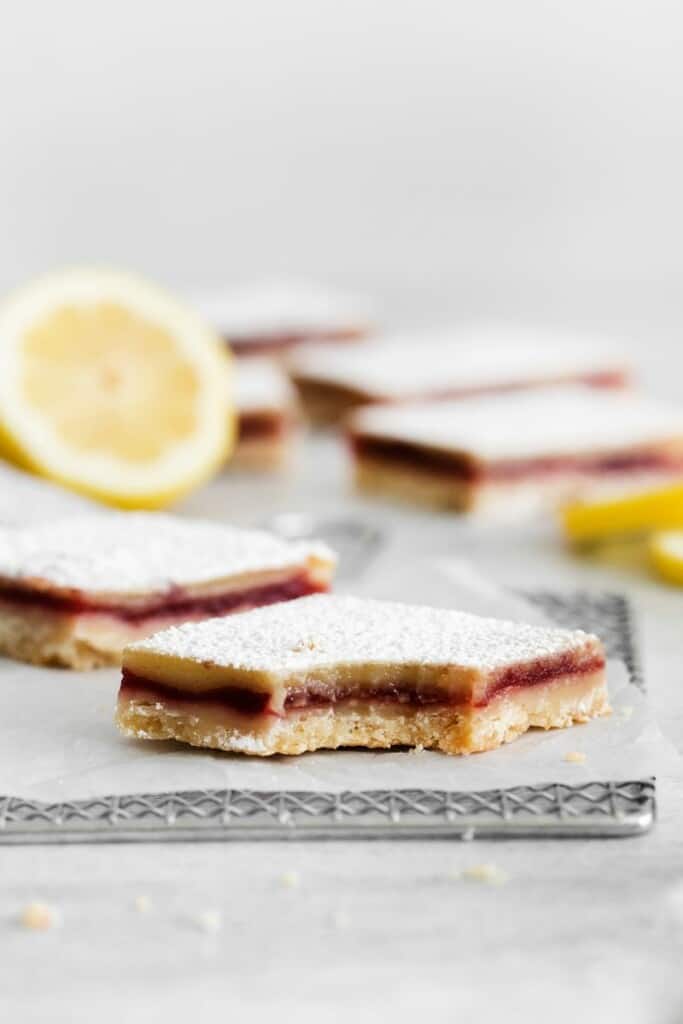 lemon cranberry bar with bite out of it
