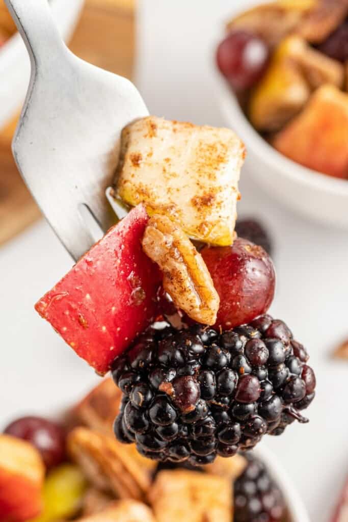 fork with fall fruit salad