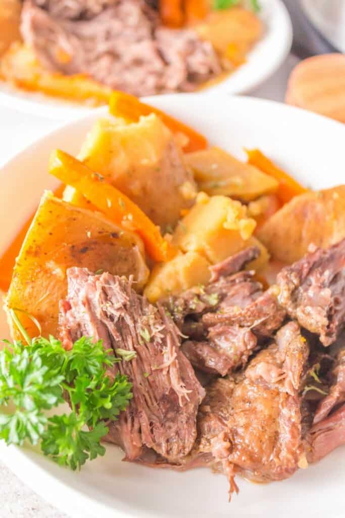 pot roast on a platter with potatoes