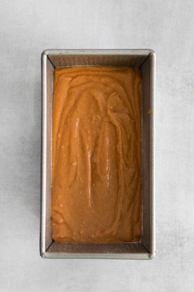 My easy pumpkin bread recipe in a loaf pan ready to be baked.