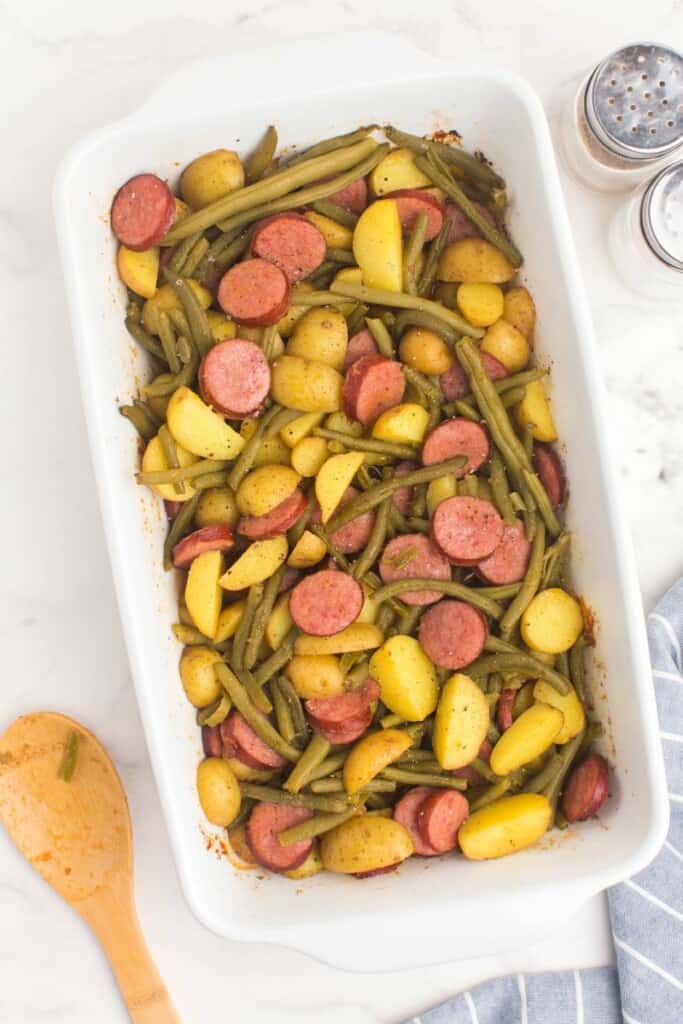 green beans, sausage, and potatoes in a casserole dish