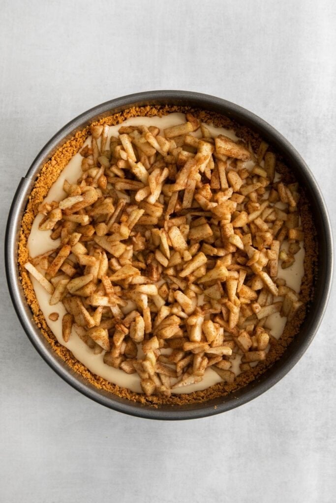 The apple mixture on top of the cheesecake filling to give it that true apple pie cheesecake recipe flavor.