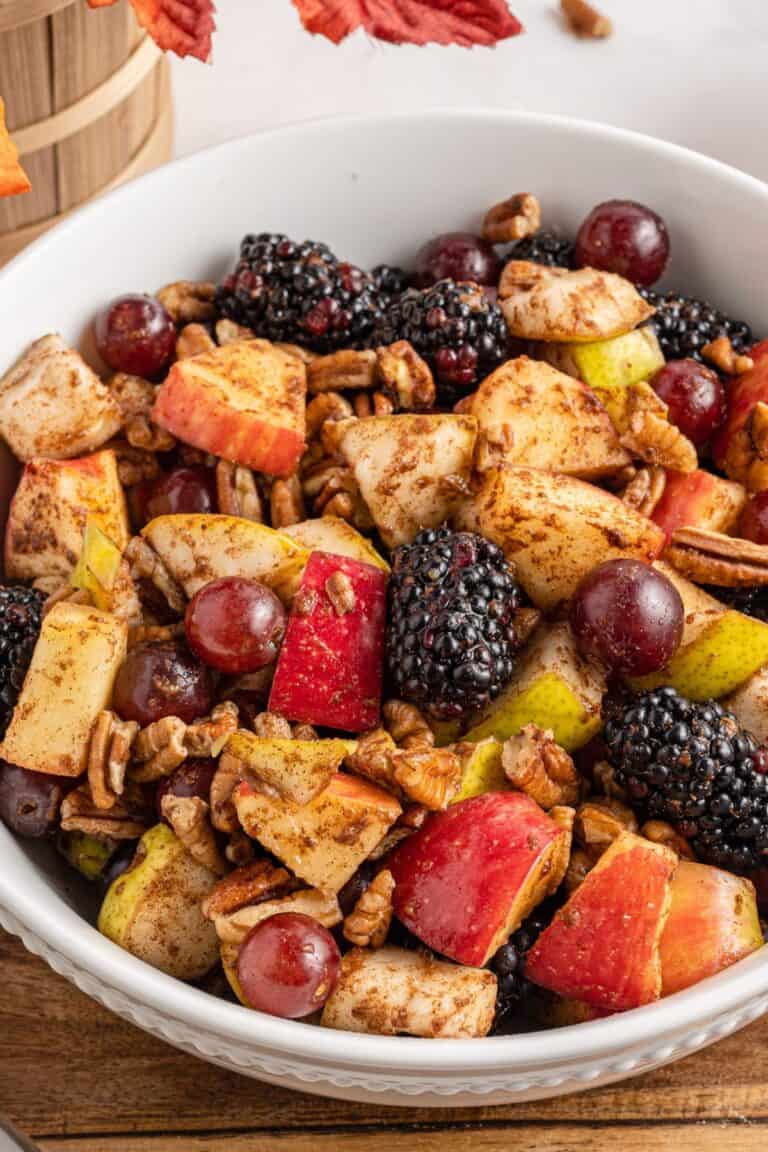 Close up of the Thanksgiving fruit salad in a white bowl.
