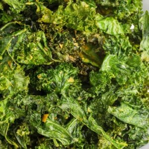 Close up of air fried kale chips to show the crispy edges.