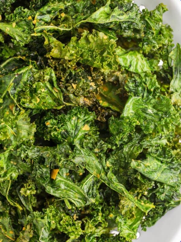 Close up of air fried kale chips to show the crispy edges.