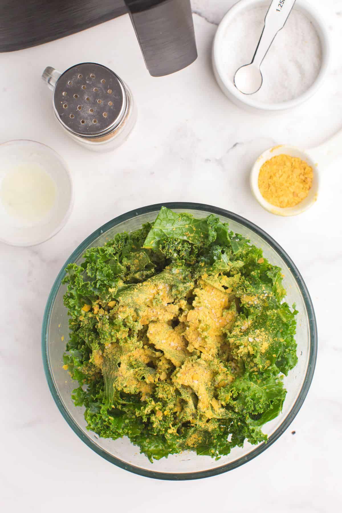 All ingredients in a bowl with the kale and about to be mixed.