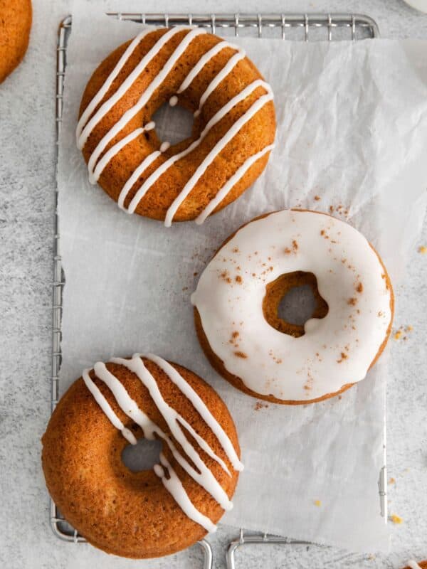 Pumpkin spice donuts with vanilla icing on top.