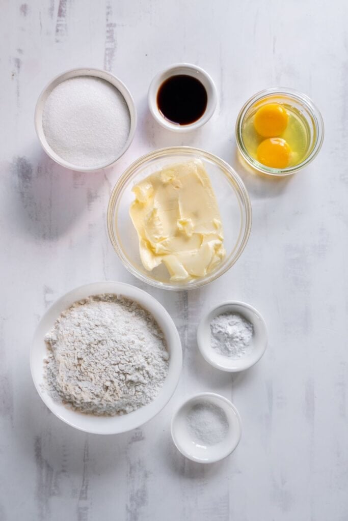 Ingredients needed to make my sugar cookie recipe without baking soda: flour, baking powder, salt, butter, sugar, eggs, and vanilla.