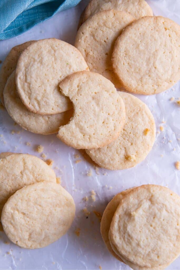 Overhead view of my sugar cookie recipe without baking soda, with a bite taken out of one of the cookies.