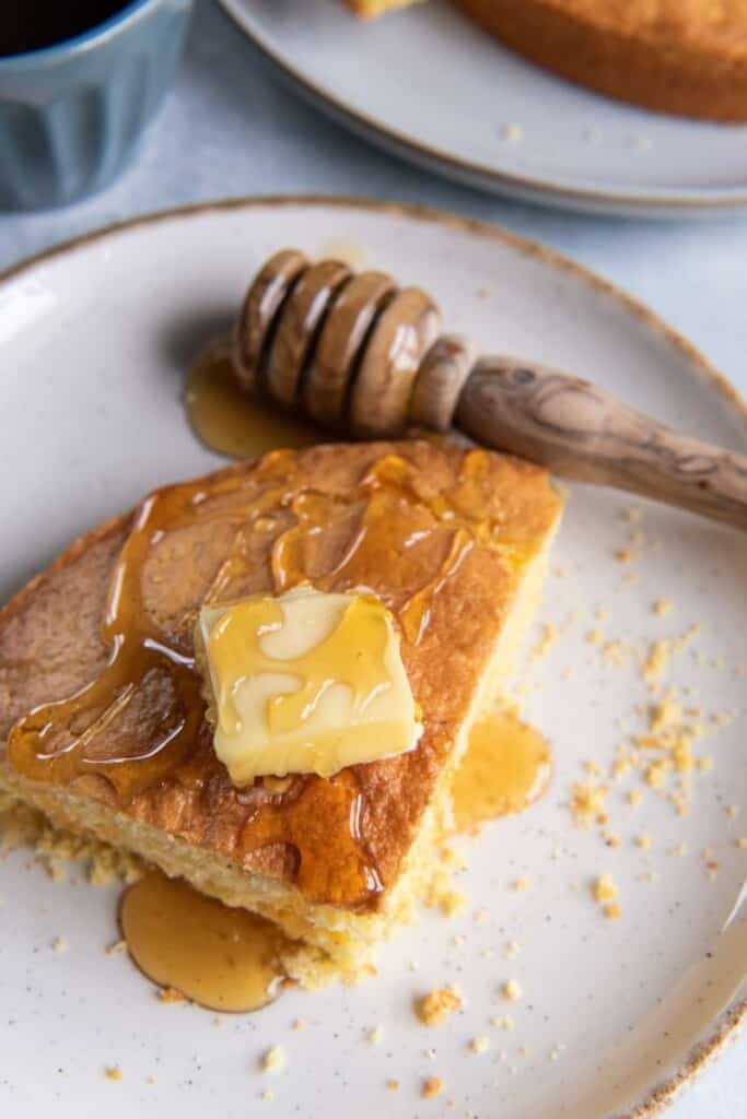 closeup of honey drizzled on a piece of cornbread