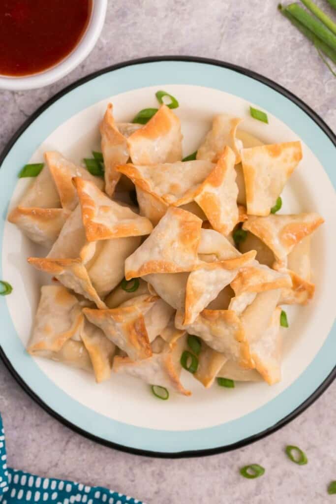plate with a mound of crab rangoon