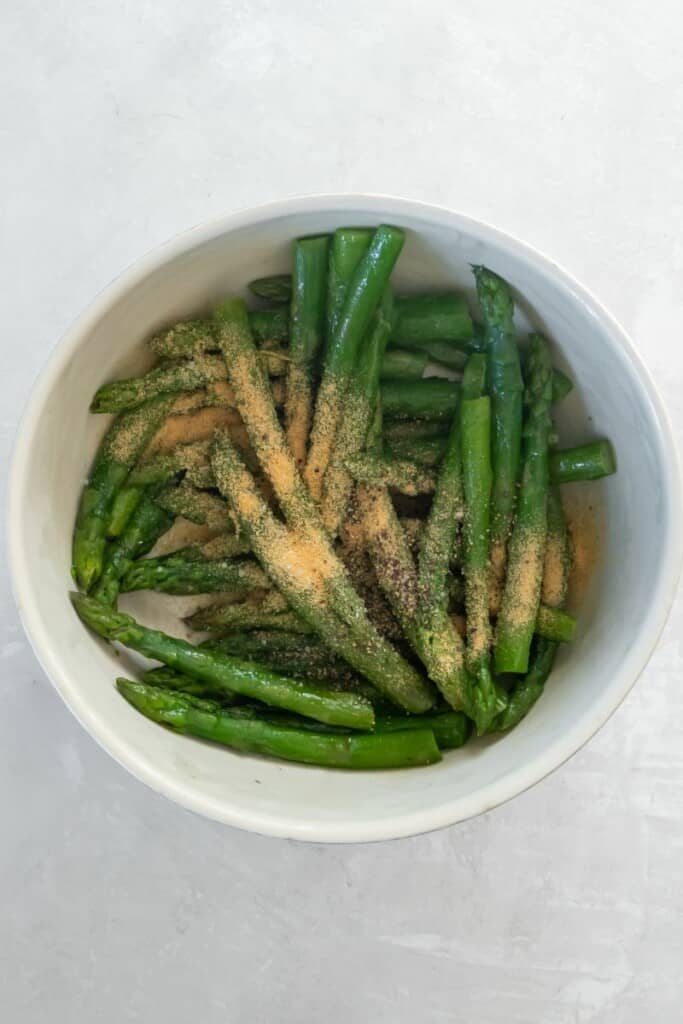 seasonings in bowl with asparagus