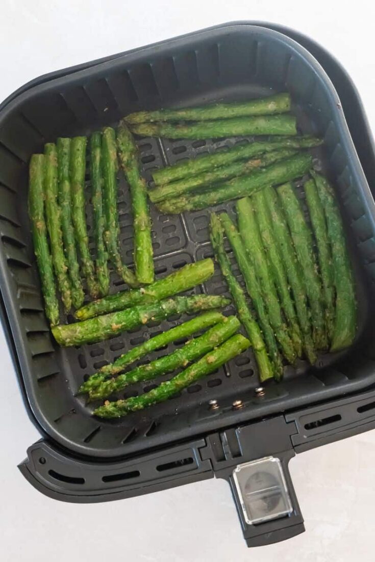 air fryer basket with asparagus