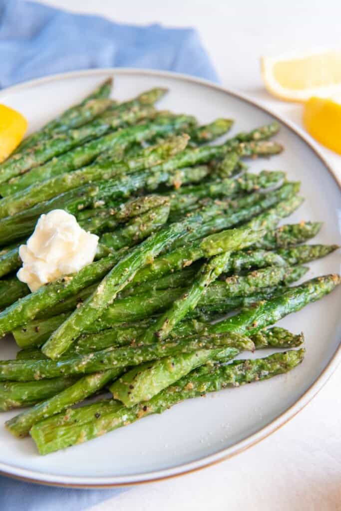white plate with asparagus