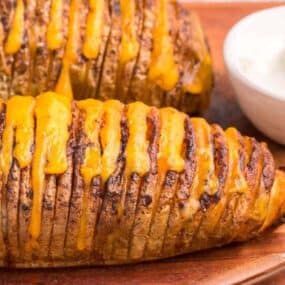 hasselback potatoes with cheese oozing out