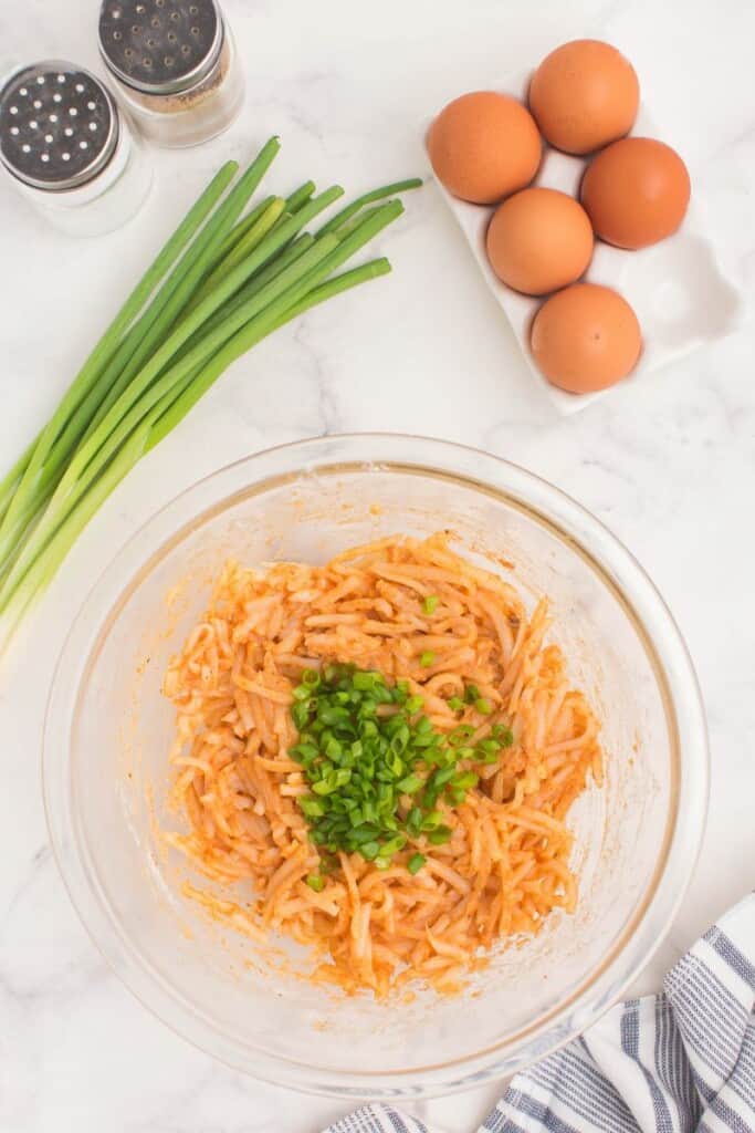 combining ingredients to make air fryer potato pancakes