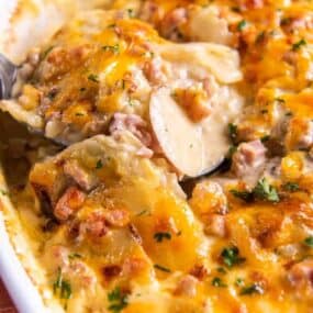 spoon with scalloped potatoes