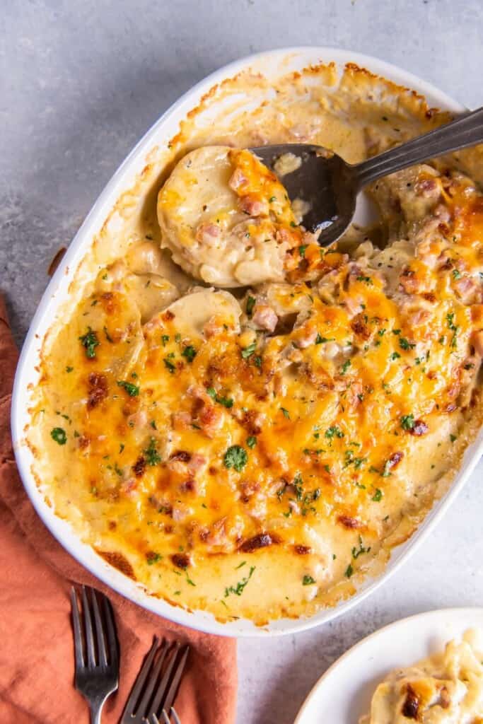 scooping scalloped potatoes