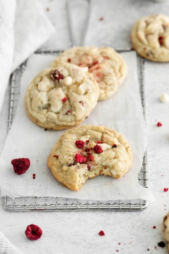 white chocolate raspberry cookie with bite out of it