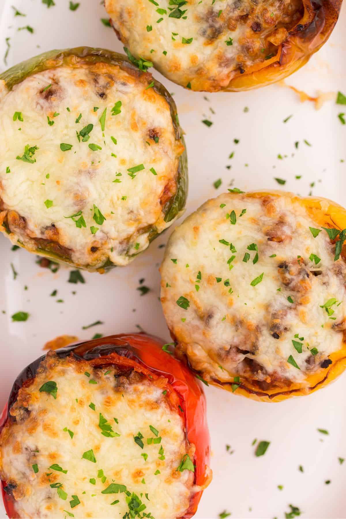 Air fryer stuffed peppers with cheese on top.