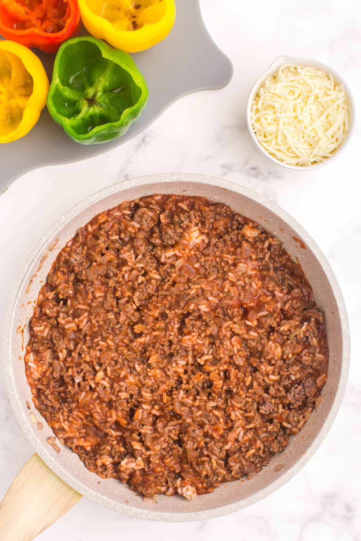 Ground beef being made in a saute pan.