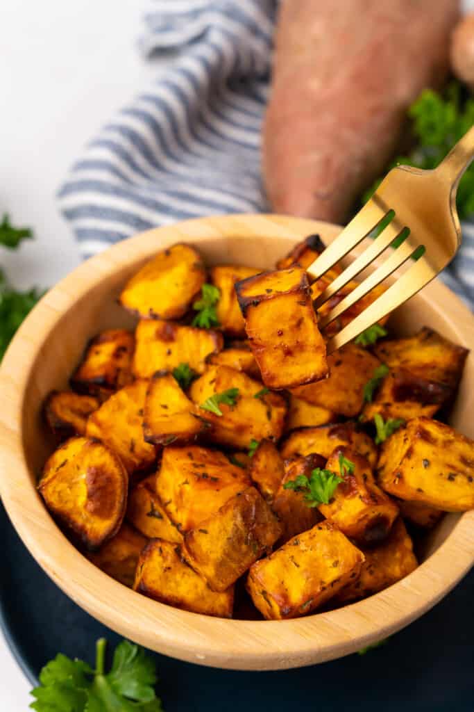 bowl with sweet potato cubes and fork