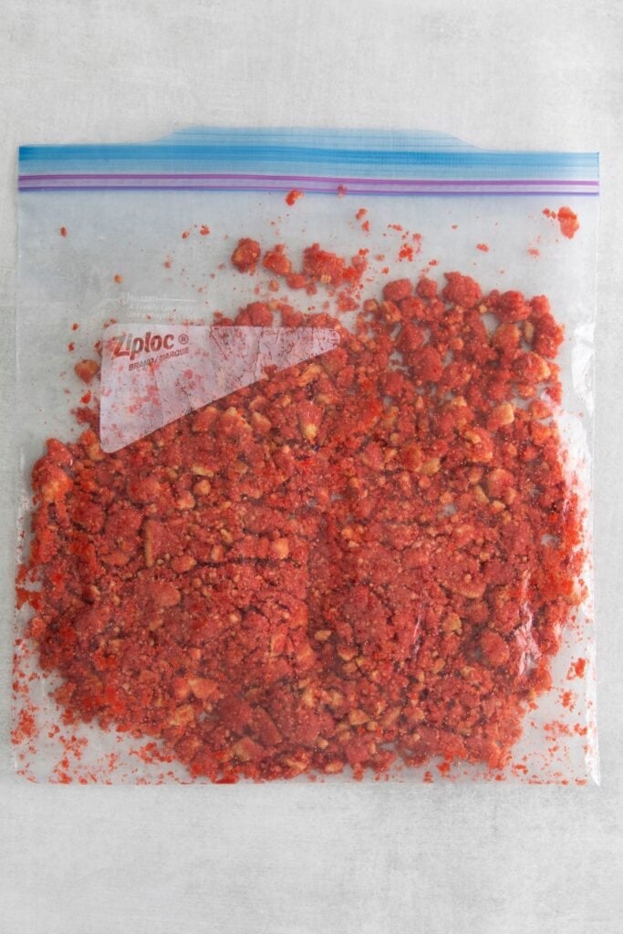 The strawberry crunch topping in a bag to top onto the strawberry crunch cake cheesecake.