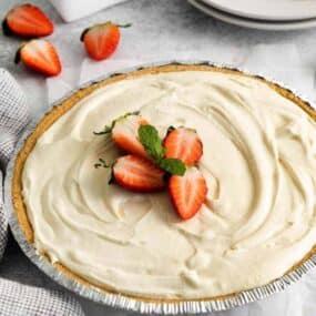 cheesecake with slices of strawberries