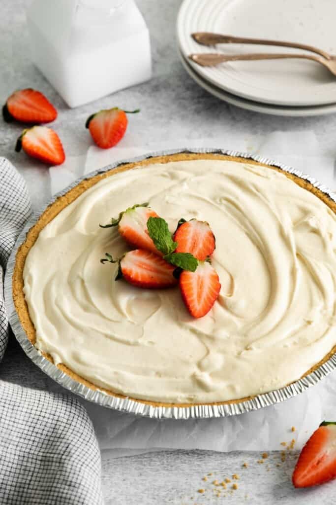 cheesecake with slices of strawberries